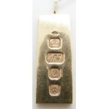 A 9ct gold ingot with feature hallmarks, 30.7g