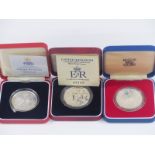 Royal Mint UK silver proof crowns comprising 1977, 1953-93 anniversary and a 1997 example, all case,