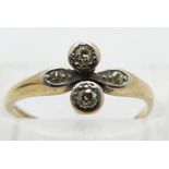 An 18ct gold ring set with diamonds in a platinum setting, size M