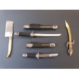 Four decorative knives including a set of two Miniature Samurai swords, largest 29cm long.