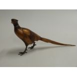 A cold painted bronze / metal figure of a pheasant,, in the manner of Bergmann. Impressed mark