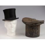 Silk top hat with letter as to where it was found, date 1886, size 6 7/8, in original tin case.