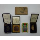 British Army WWII Defence Medal together with four shooting medals, Gloucestershire interest,