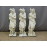 Three garden statues of semi nude ladies, height 80cm
