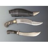 Two inlaid kukri, one in scabbard, largest 43cm