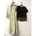 Green brocade dress and black shirt with embroidered hem
