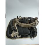 South American western style leather saddle with embossed decoration, stirrups, engraved studs and