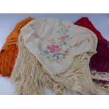 Three fringed shawls including an embroidered example