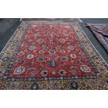 A large Persian Tabriz carpet, having all over floral palmette design,