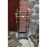 An old brass four division stick stand, 21.5cm wide.