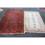 A Persian rug, having red ground; together with one other rug, 187 x 114cm.