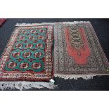 A Turkish rug having floral border; together with one other rug, largest, 150 x 104cm.