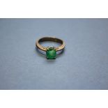 An unmarked ring set oval Columbian emerald; together with a loose oval ruby gem stone, 15mm x 11mm,