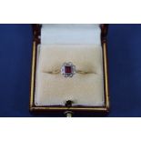 An Edwardian 18ct gold and platinum ruby and diamond ring.