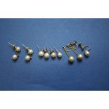 A pair of 9ct gold pearl eardrops; together with three pairs of various gold and pearl ear studs;