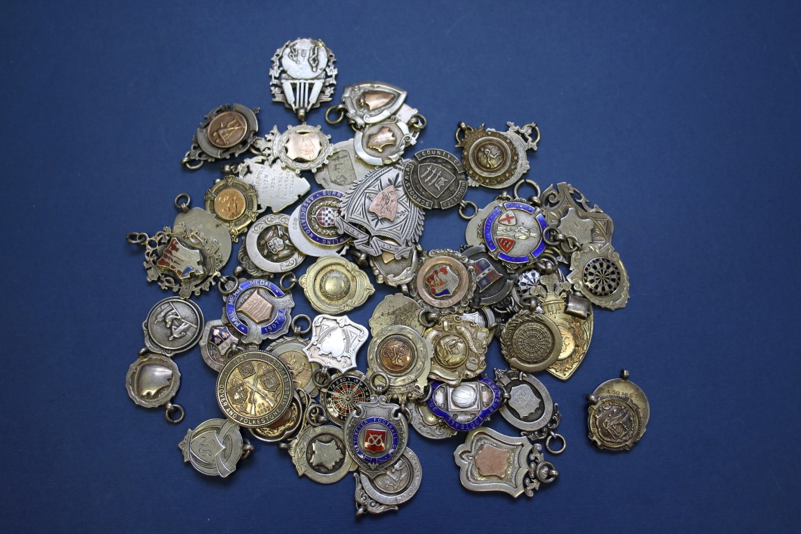 A collection of fifty four 19th and 20th century silver, enamel and metal sporting medals.