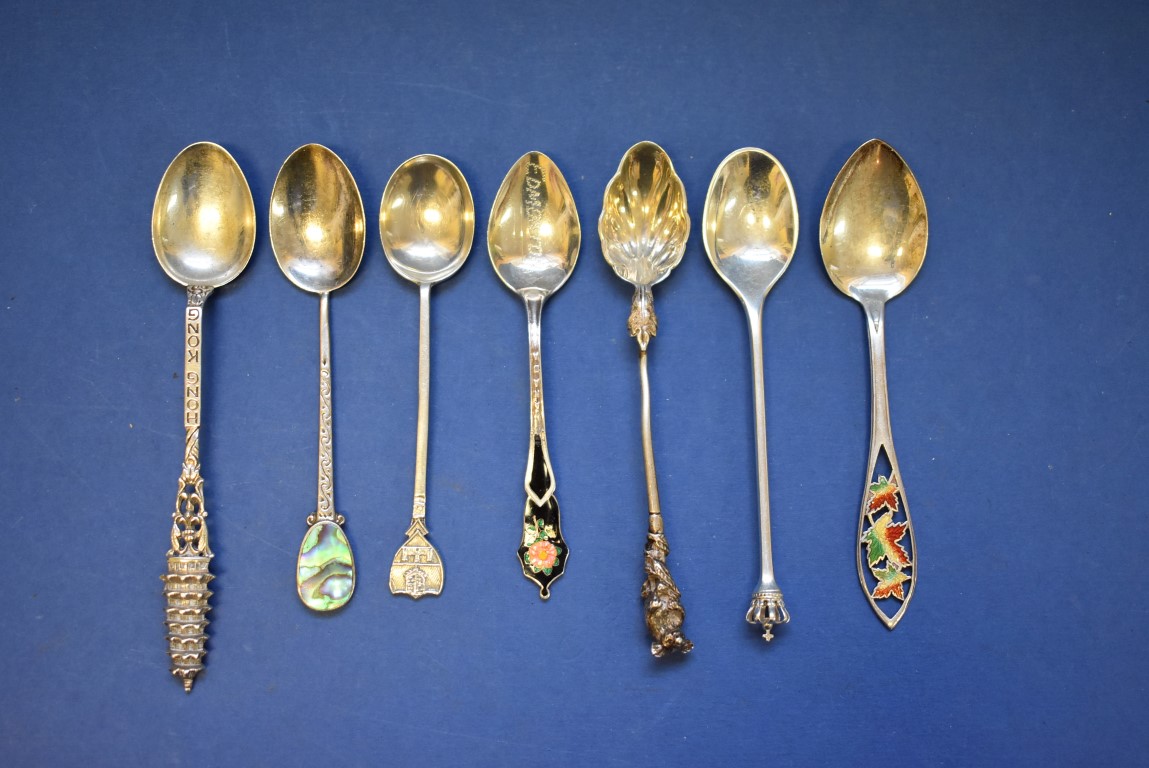 A quantity of silver cutlery, to include commemorative silver and enamel spoons,