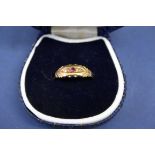 An Edwardian 18ct gold ruby and diamond ring.