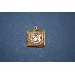 An antique Arabic Cornelian engraved plaque mounted in Egyptian yellow metal pendant mount. 1.4 x 1.