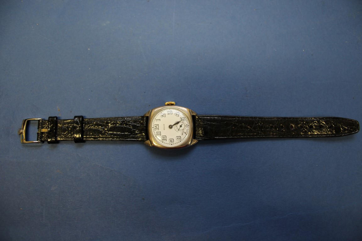 A 1927 Rolex Sporting Model silver gentleman's wristwatch, having black leather strap.