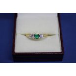 An 18ct gold square cut emerald and diamond ring. Condition Report: Good.