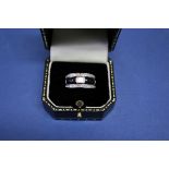 An 18ct white gold diamond and onyx dress ring, approx 1.