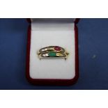 A modern 9ct gold Tudor betrothal ring set cabochon ruby; together with another example set emerald.