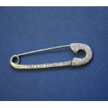 An 18ct white gold diamond set safety pin brooch, approx 0.