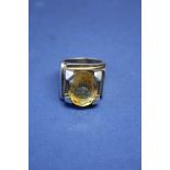 A large chunky white metal ring set oval citrine.