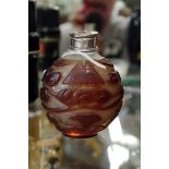 A Chinese intaglio snuff bottle, with metal rim, 8.6cm high.