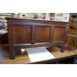 An 18th century oak panelled coffer, the interior with candle box, 127cm wide.