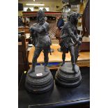 A pair of spelter figures, each on an ebonized base, total height 45cm.