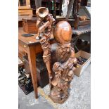A large Japanese carved wood figure of an immortal, 93cm high.