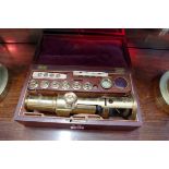 A 19th century brass monocular microscope, of Culpeper style, in original mahogany fitted case,