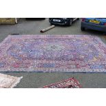 A large Persian rug, having allover floral design,