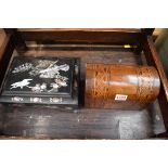 A Victorian parquetry dome top tea caddy; together with an oriental lacquer casket.