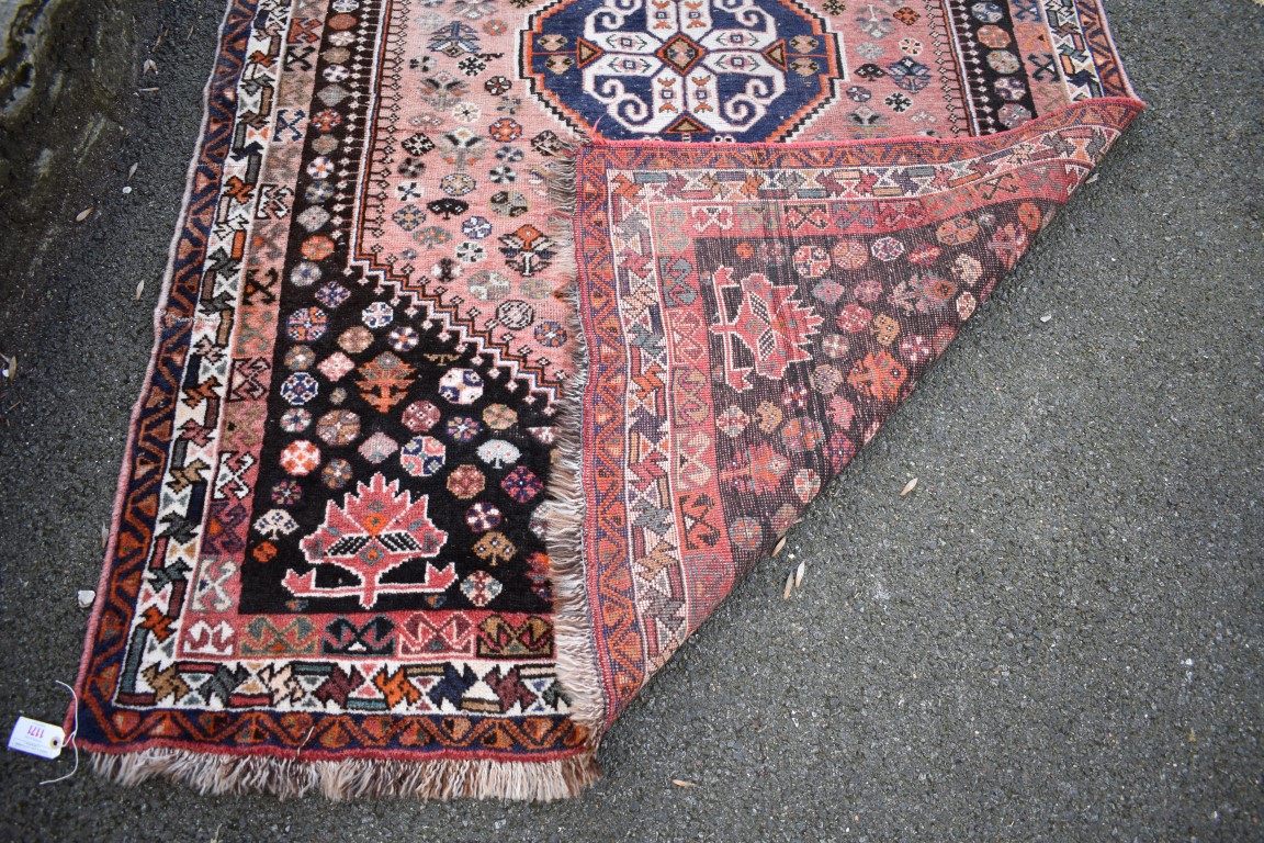 An Eastern wool rug having geometric design on red and brown ground; - Image 4 of 8