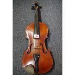 An antique Continental violin, labelled 'Antonius Stradivarius', cased.