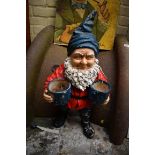 An old polychrome painted pottery gnome, 71cm high.