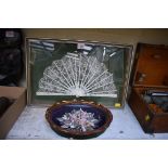 A cased Victorian bone and lace fan,; together with a shell picture,