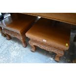 A pair of carved hardwood low tables, 50.5cm wide.