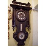 A 19th century Continental stained and carved pine combined wall clock and barometer,