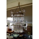 A two tier chandelier; together with with a bag chandelier.