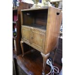 A walnut bedside cupboard, 51.5cm wide.