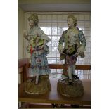 A pair of large Sitzendorf figures, 36.5cm high, (chips).