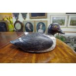 Two antique carved and painted decoy ducks.