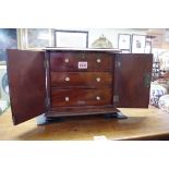 A 19th century mahogany miniature cabinet, 26.5cm wide.