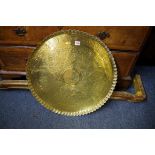An Eastern brass tray or table top, 59.5cm diameter.