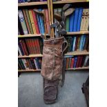 A vintage bag of old golf clubs.