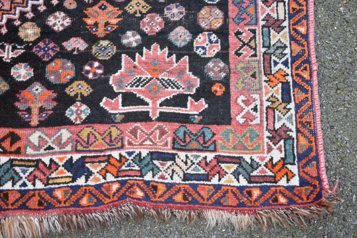 An Eastern wool rug having geometric design on red and brown ground; - Image 3 of 8